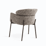 Modern accent chair with textured upholstery and sleek black metal legs, perfect for living rooms and offices.