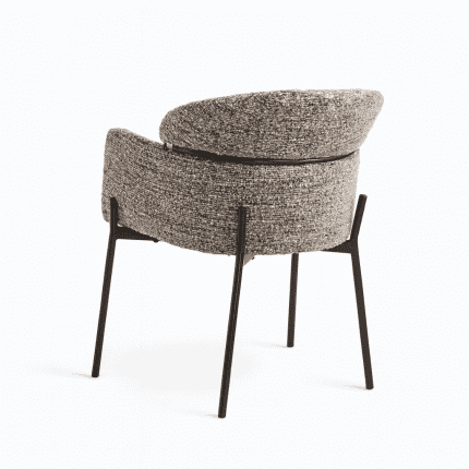 Modern accent chair with textured upholstery and sleek black metal legs, perfect for living rooms and offices.